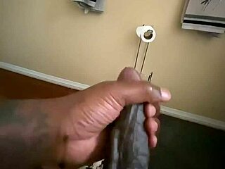 I'm tugging my big black cock in this solo homemade handjob session.