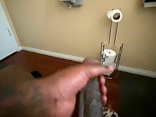 I'm tugging my big black cock in this solo homemade handjob session.