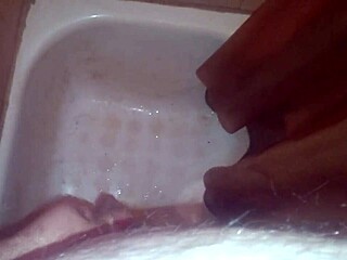 guy pees while jerking off and shoots jizz