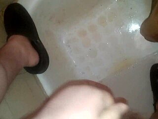 guy pees while jerking off and shoots jizz