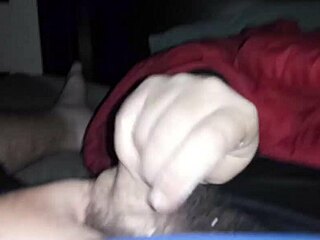 Sarah gives an amazing handjob to his cock in this scene