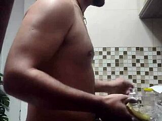 Macho guy bent over in intense doggystyle while washing dishes.