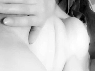 BUSTY MILF CARESSES HER BIG TITS TO ORGASM