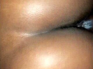 Young black teen bent over doggystyle.