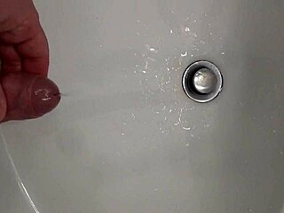 He's Pissing with a Hard Cock, Ready for That Cumshot Blast