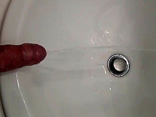 He's Pissing with a Hard Cock, Ready for That Cumshot Blast