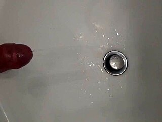 He's Pissing with a Hard Cock, Ready for That Cumshot Blast