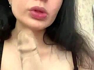 Cute student demonstrates using a big dildo toy in class