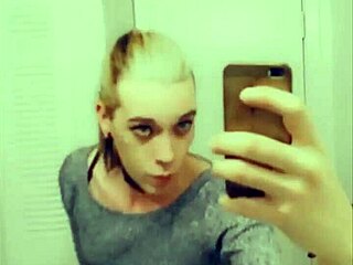 Pretty transsexual in stockings teases her body