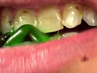 close up of fifi foxx's mouth vore while eating gummy bears