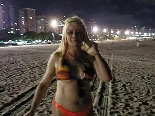 Blonde shows tits and pussy on the beach, voyeur style.