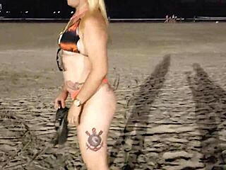 Blonde shows tits and pussy on the beach, voyeur style.
