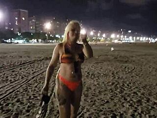 Blonde shows tits and pussy on the beach, voyeur style.