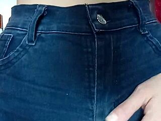 Playing with a belt on her tight pussy