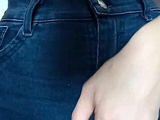 Playing with a belt on her tight pussy