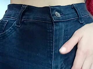 Playing with a belt on her tight pussy