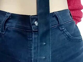 Playing with a belt on her tight pussy