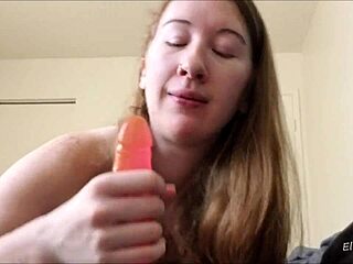 the redhead with tattoos sucks dick using toys and dildo, ending with facial.