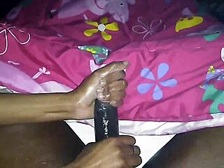 Ebony BBW milf gives handjob to big black cock