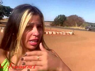 Bibi Tsunami interacts with people on the roadside in Varjão de Minas, MG.