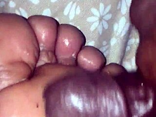 girlfriend gives footjob to boyfriend
