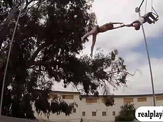 Blonde and brunette babes swing naked in outdoor reality