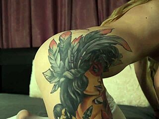 Blonde beauty oils up and fingers her tight pussy.