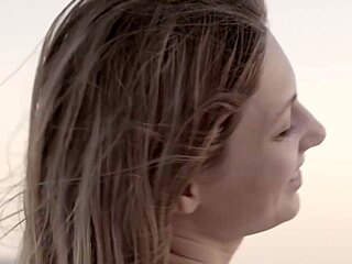 Talia Mint, petite and beautiful, decides to masturbate openly on the crowded public beach under the sun.