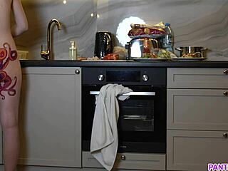 Naked housewife with octopus tattoo on her big ass cooks dinner in the kitchen and ignores you completely.