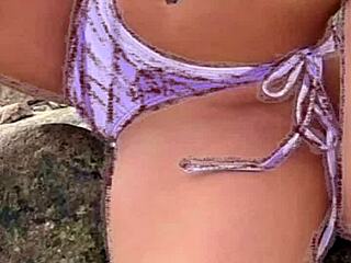 hot african woman in bikini on beach jerks off discreetly