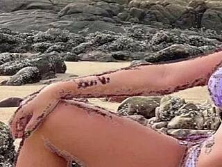 hot african woman in bikini on beach jerks off discreetly