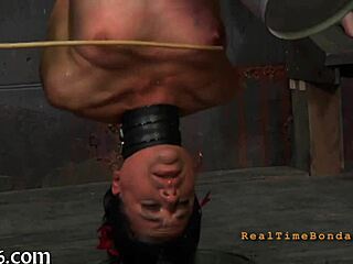 Pornstar engages in sadomasochistic activities with intense focus