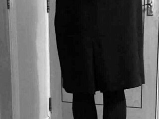 Crossdresser in uniform binds himself with handcuffs