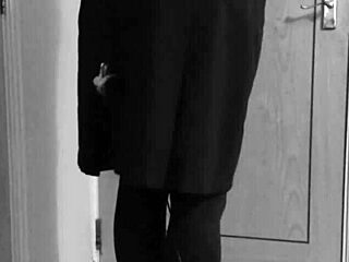 Crossdresser in uniform binds himself with handcuffs