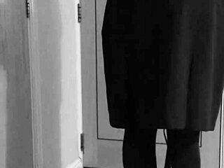 Crossdresser in uniform binds himself with handcuffs