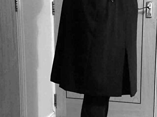 Crossdresser in uniform binds himself with handcuffs