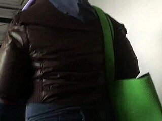 Chubby girl’s brown nylon jacket touched on street