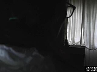 The demon grips the skinny brunette in horror.