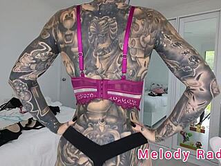 does melody radford look sexy in black and purple lingerie?