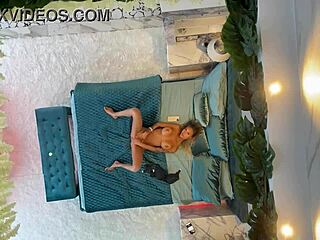 monika fox posing on the bed with piercing and fake tits