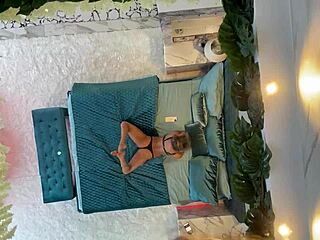 monika fox posing on the bed with piercing and fake tits