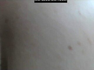 Zamira in her first costume and Aleja in Ecuador shirt watching the game