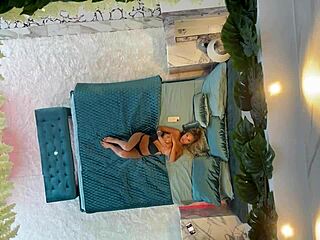 monika fox posing on the bed with piercing and fake tits