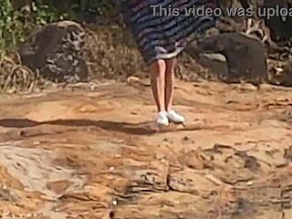 Look at this stunning Brazilian girl getting banged publicly on beach rocks!