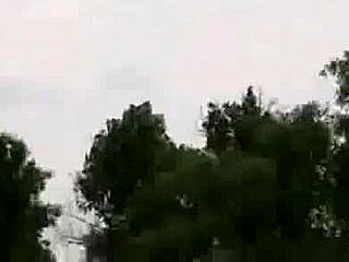 Skinny brown haired girl GETS NAKED by the lake in this video.