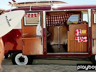 Behind the scenes, a nude surfer slut poses on the beach