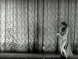 Vintage showgirls perform classic striptease