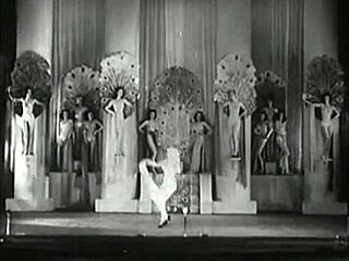 Vintage showgirls perform classic striptease