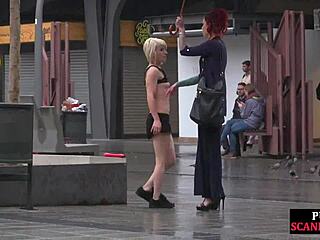 hey, watch this public slut get humiliated by strict domina on street!