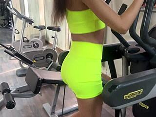 trainer offers new exercises to katty in the gym and they work out together